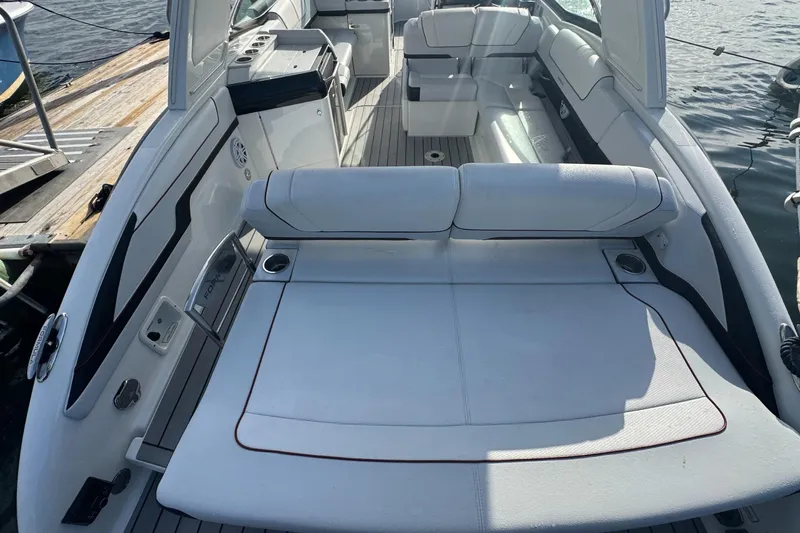  Yacht Photos Pics 2022 Formula 310 Bowrider OB interior with spacious seating and sleek design.