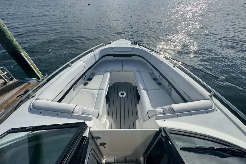  Yacht Photos Pics 2022 Formula 310 Bowrider OB boat interior with spacious seating on calm water.