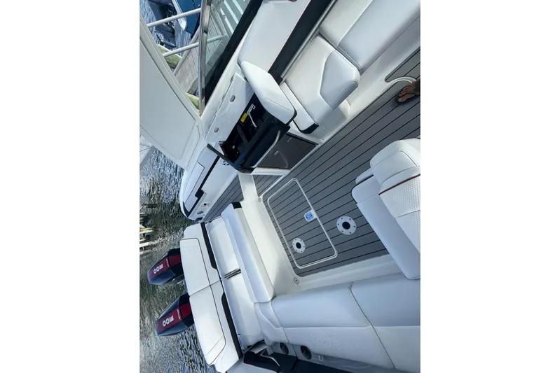  Yacht Photos Pics 2022 Formula 310 Bowrider OB interior with white seating and dual outboard motors.