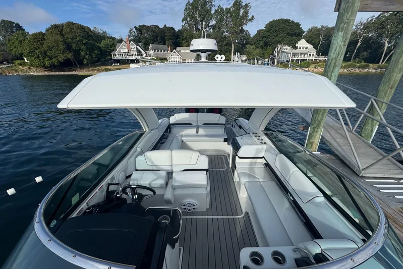  Yacht Photos Pics 2022 Formula 310 Bowrider OB docked, showcasing spacious seating and sleek design.