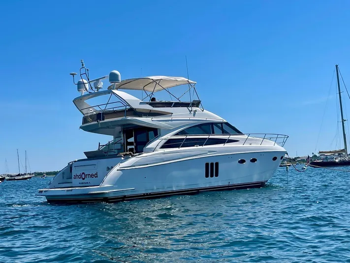 Ahdorned Yacht Photos Pics Luxury Princess F54 yacht from 2009 on calm blue waters.