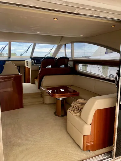 Ahdorned Yacht Photos Pics Luxurious interior of 2009 Princess F54 yacht with elegant seating and wooden accents.