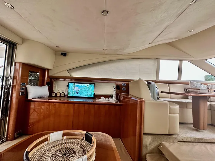 Ahdorned Yacht Photos Pics Luxurious interior of 2009 Princess F54 yacht with elegant seating and entertainment area.