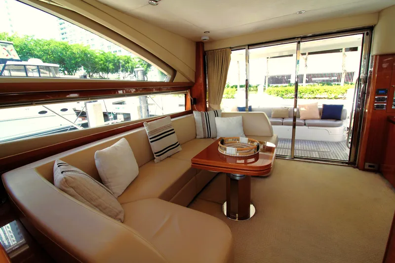 Ahdorned Yacht Photos Pics Luxurious interior of 2009 Princess F54 yacht with elegant seating and large windows.