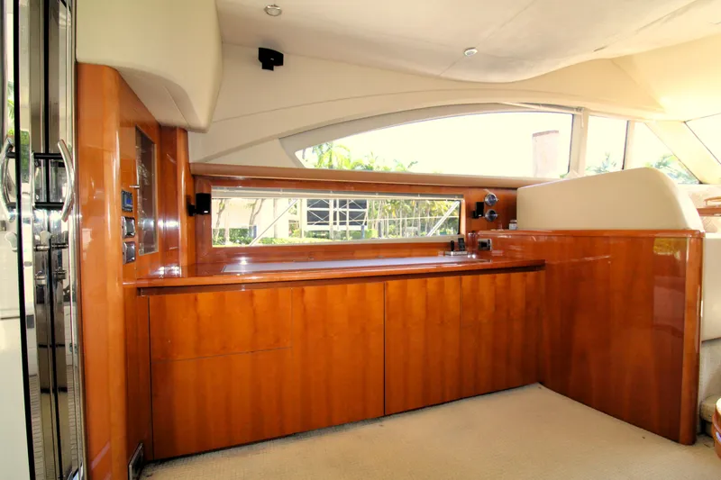 Ahdorned Yacht Photos Pics Luxurious interior of 2009 Princess F54 yacht with sleek wooden cabinetry.