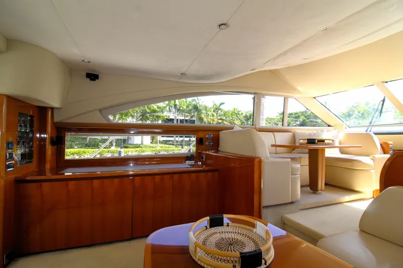 Ahdorned Yacht Photos Pics Luxurious interior of 2009 Princess F54 yacht with elegant seating and wooden finishes.