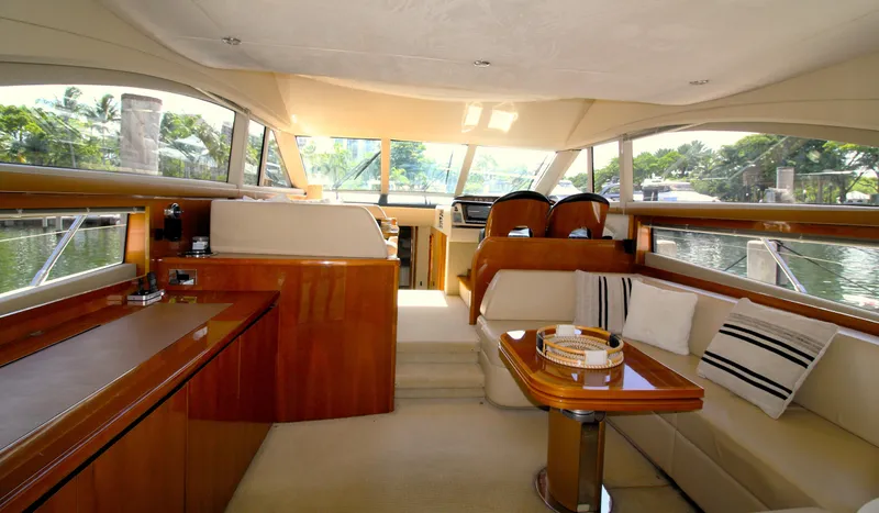 Ahdorned Yacht Photos Pics Luxurious interior of 2009 Princess F54 yacht with elegant seating and wooden finishes.