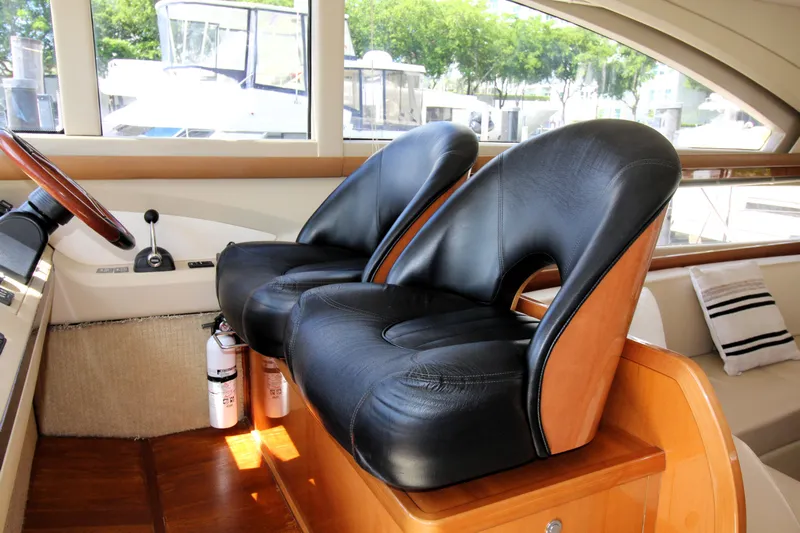 Ahdorned Yacht Photos Pics Luxurious 2009 Princess F54 yacht interior with leather seats and wooden accents.
