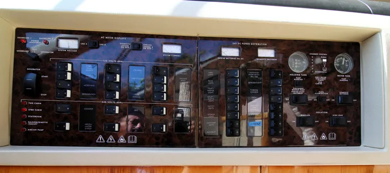 Ahdorned Yacht Photos Pics Control panel of a 2009 Princess F54 yacht, featuring various switches and gauges.