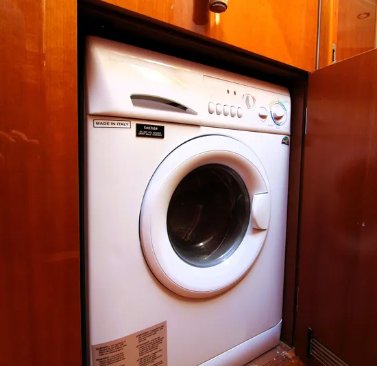 Ahdorned Yacht Photos Pics Front-loading washing machine in wooden cabinet, Princess F54 yacht, 2009 model.