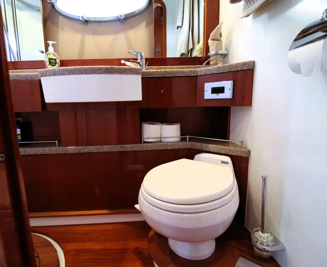 Ahdorned Yacht Photos Pics Luxurious yacht bathroom with modern fixtures, wooden cabinetry, and elegant design. Princess F54, 2009.