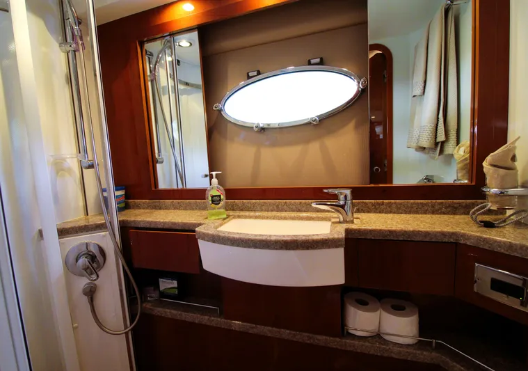 Ahdorned Yacht Photos Pics Luxurious bathroom in 2009 Princess F54 yacht with modern fixtures and elegant design.