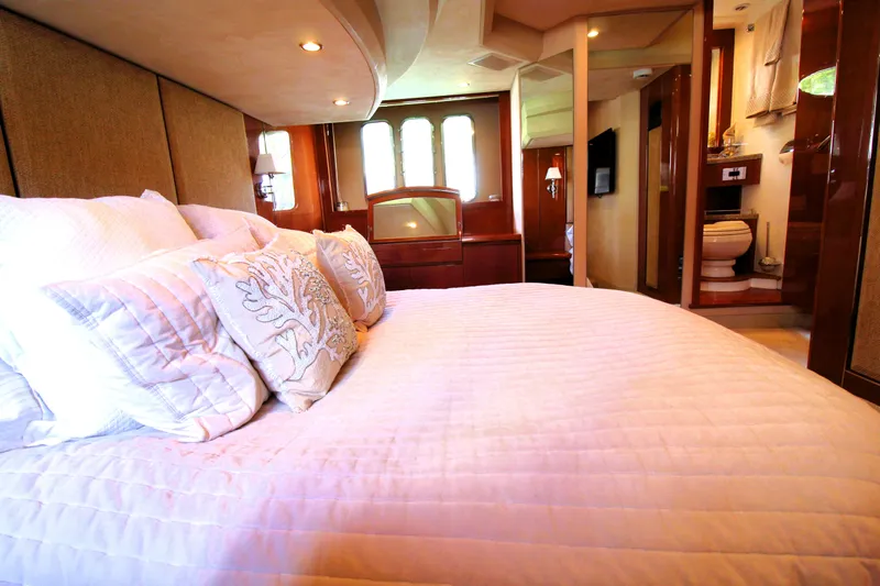 Ahdorned Yacht Photos Pics Luxurious bedroom interior on 2009 Princess F54 yacht with elegant bedding and ensuite bathroom.