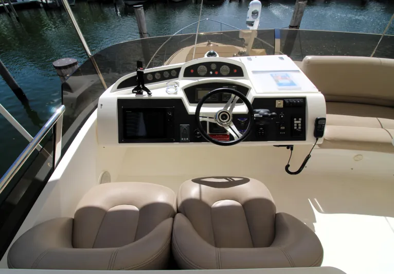 Ahdorned Yacht Photos Pics Helm of 2009 Princess F54 yacht with dual seats and control panel.