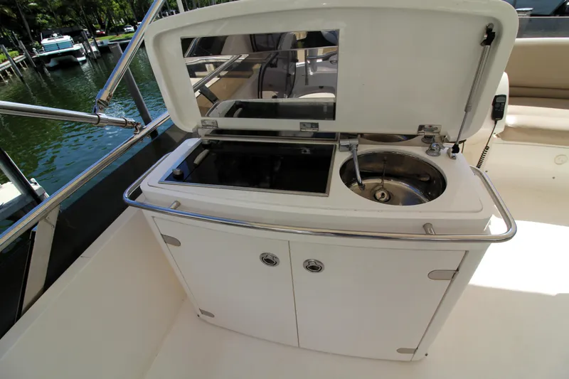 Ahdorned Yacht Photos Pics Outdoor kitchenette on a 2009 Princess F54 yacht with sink and storage.