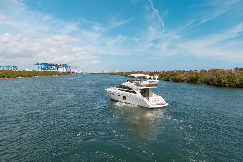 Ahdorned Yacht Photos Pics Luxury Princess F54 yacht cruising on a scenic waterway, 2009 model.