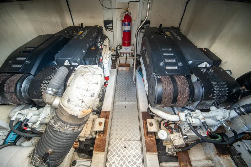 Ahdorned Yacht Photos Pics Engine room of a 2009 Princess F54 yacht with dual Volvo engines and fire extinguisher.