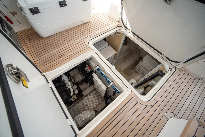 Ahdorned Yacht Photos Pics Engine compartment of 2009 Princess F54 yacht with open hatches on teak deck.