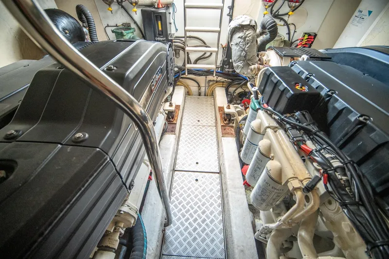 Ahdorned Yacht Photos Pics Engine room of a 2009 Princess F54 yacht, showcasing dual engines and mechanical components.