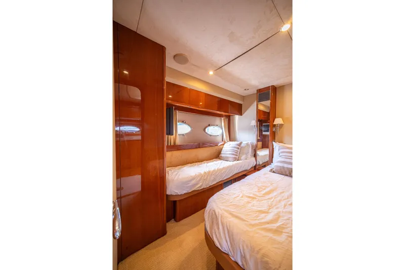 Ahdorned Yacht Photos Pics Luxurious cabin interior of 2009 Princess F54 yacht with elegant wood finishes.