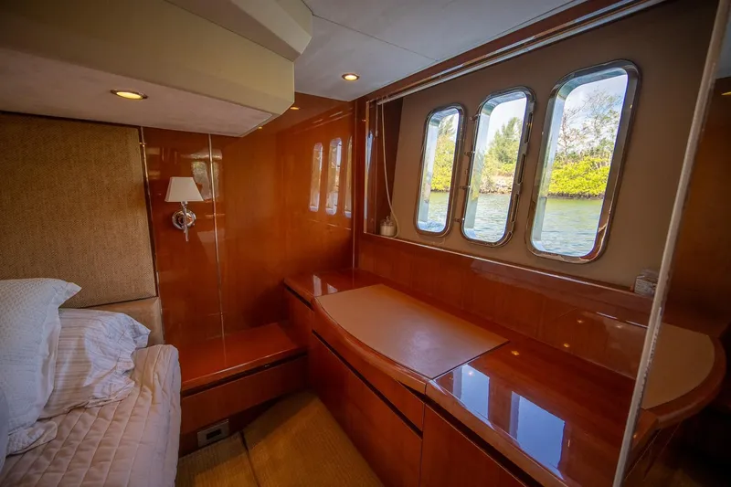 Ahdorned Yacht Photos Pics Luxurious cabin interior of 2009 Princess F54 yacht with wood finish and scenic windows.