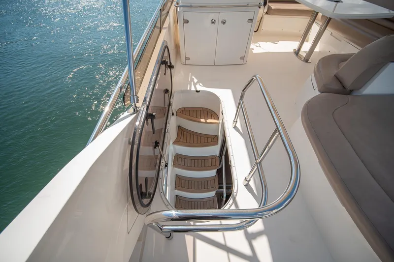 Ahdorned Yacht Photos Pics Luxurious 2009 Princess F54 yacht deck with elegant seating and staircase.