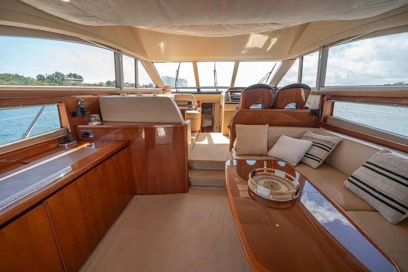Ahdorned Yacht Photos Pics Luxurious interior of 2009 Princess F54 yacht with elegant seating and panoramic windows.