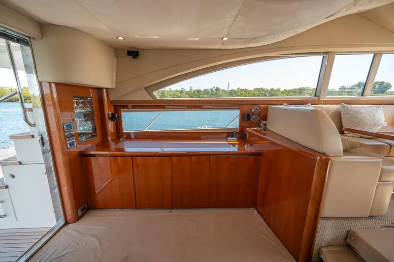 Ahdorned Yacht Photos Pics Luxurious interior of 2009 Princess F54 yacht with elegant wood finish and scenic window view.