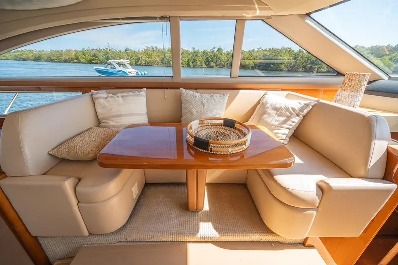 Ahdorned Yacht Photos Pics Luxurious interior of 2009 Princess F54 yacht with elegant seating and scenic water view.