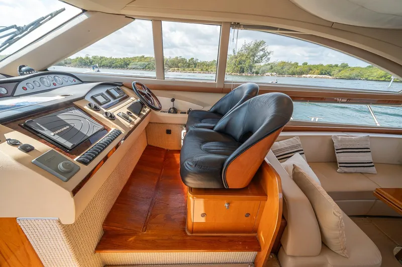 Ahdorned Yacht Photos Pics Luxurious 2009 Princess F54 yacht interior with leather seats and navigation controls.