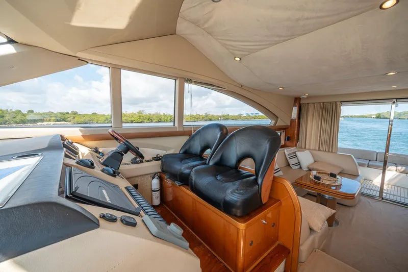Ahdorned Yacht Photos Pics Luxurious interior of 2009 Princess F54 yacht with leather seating and scenic water view.