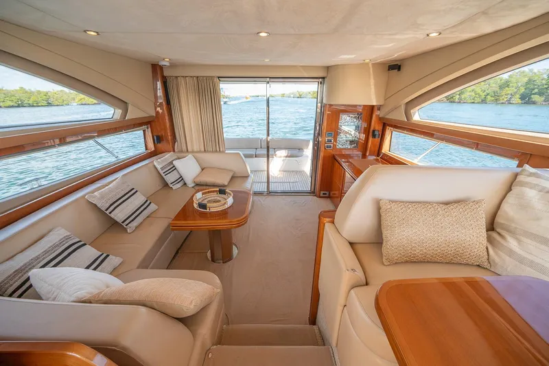 Ahdorned Yacht Photos Pics Luxurious interior of 2009 Princess F54 yacht with elegant seating and scenic water view.