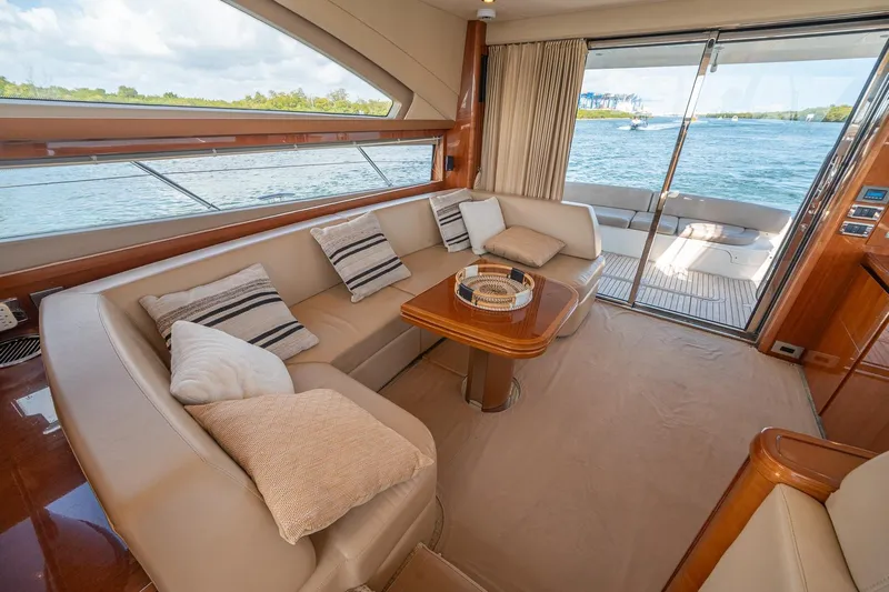 Ahdorned Yacht Photos Pics Luxurious 2009 Princess F54 yacht interior with elegant seating and scenic ocean view.