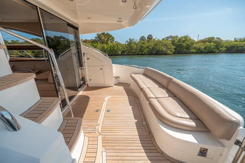 Ahdorned Yacht Photos Pics Luxurious 2009 Princess F54 yacht deck with elegant seating and scenic water view.