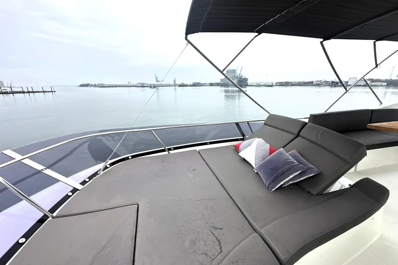 Cyctrade Yacht Photos Pics Luxurious 2017 Prestige 500 yacht deck with comfortable seating and scenic waterfront view.