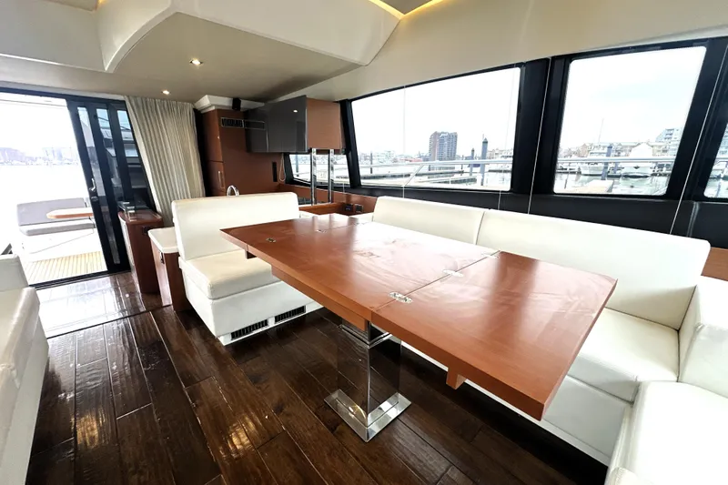 Cyctrade Yacht Photos Pics Luxurious interior of 2017 Prestige 500 yacht with elegant wood and white seating.