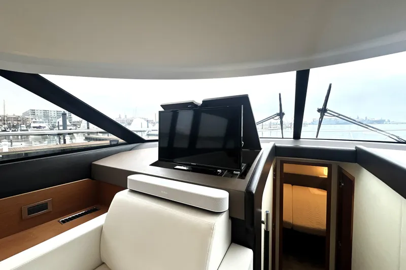 Cyctrade Yacht Photos Pics Interior of 2017 Prestige 500 yacht with TV and luxurious seating.