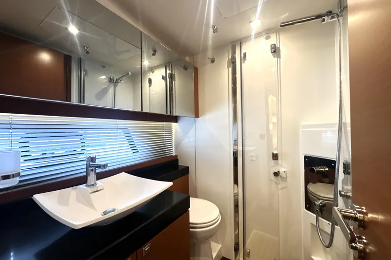 Cyctrade Yacht Photos Pics Luxurious bathroom in 2017 Prestige 500 yacht with modern fixtures and sleek design.