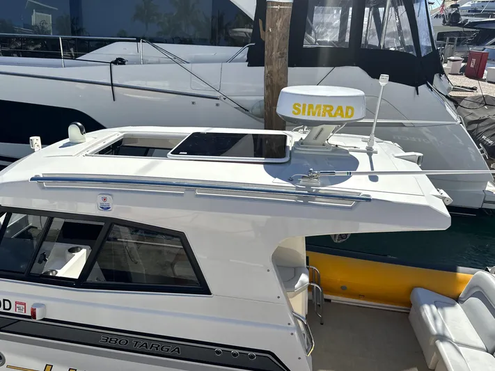 Lizzie Yacht Photos Pics 2020 Protector TARGA 380 boat with Simrad radar, docked at marina.