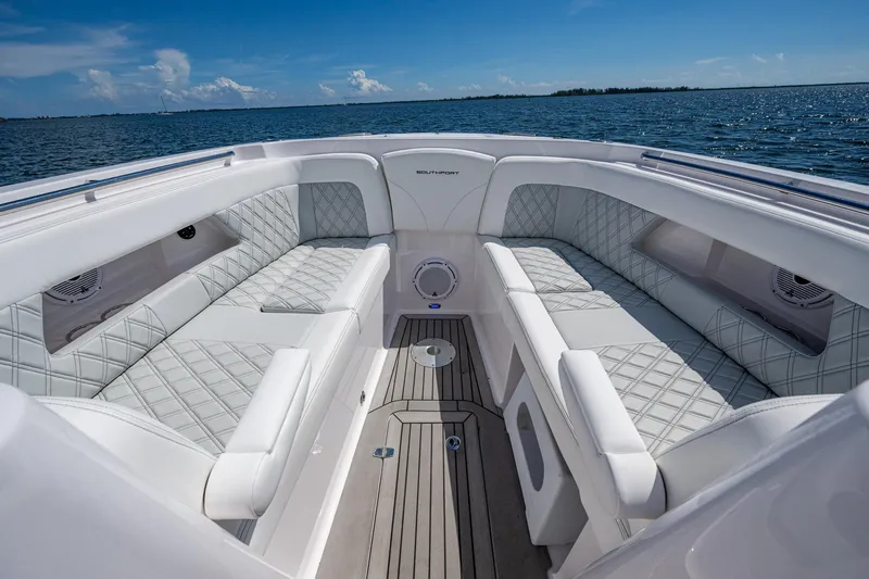  Yacht Photos Pics Luxurious interior of 2022 Southport 33 DC boat with elegant seating and ocean view.