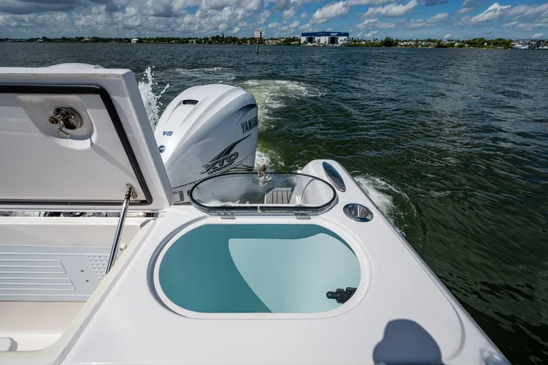  Yacht Photos Pics 2022 Southport 33 DC boat with Yamaha engine on open water.