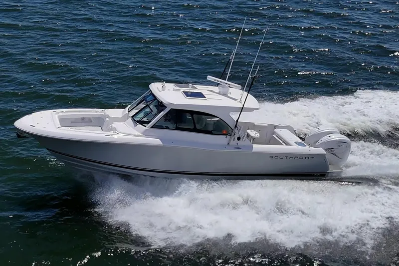  Yacht Photos Pics 2022 Southport 33 DC boat cruising on open water.