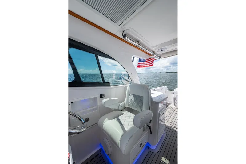  Yacht Photos Pics 2022 Southport 33 DC boat interior with luxury seating and ocean view.
