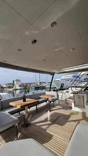 Diamond Si Yacht Photos Pics Luxurious 2024 Prestige M48 yacht interior with elegant seating and wooden flooring.