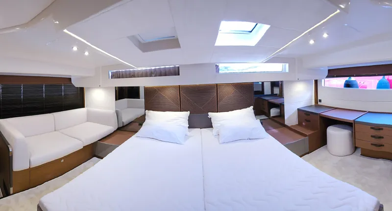 Diamond Si Yacht Photos Pics Luxurious interior of 2024 Prestige M48 yacht with spacious bed and modern furnishings.