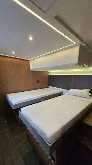 Diamond Si Yacht Photos Pics 2024 Prestige M48 yacht cabin with modern twin beds and ambient lighting.