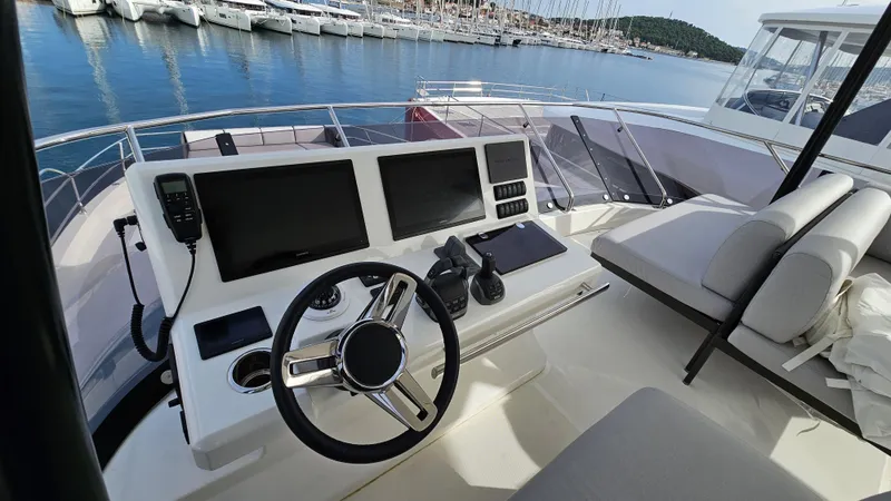 Diamond Si Yacht Photos Pics Luxury yacht helm with modern controls, Prestige M48, 2024 model, docked at marina.