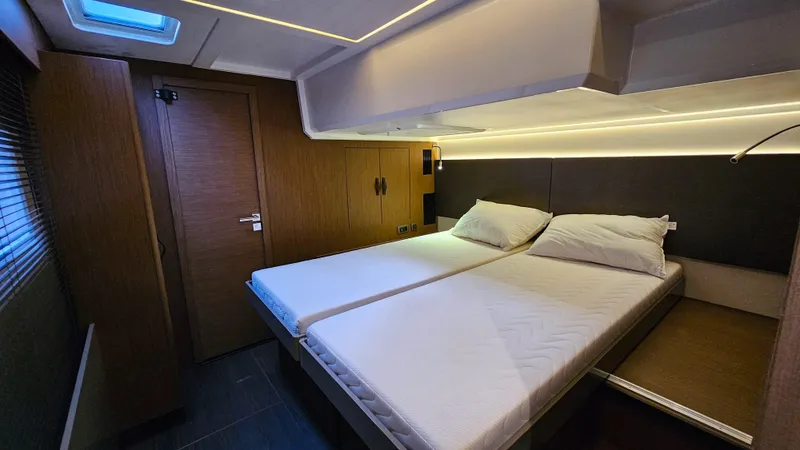 Diamond Si Yacht Photos Pics Luxurious cabin interior of 2024 Prestige M48 yacht with twin beds and modern lighting.