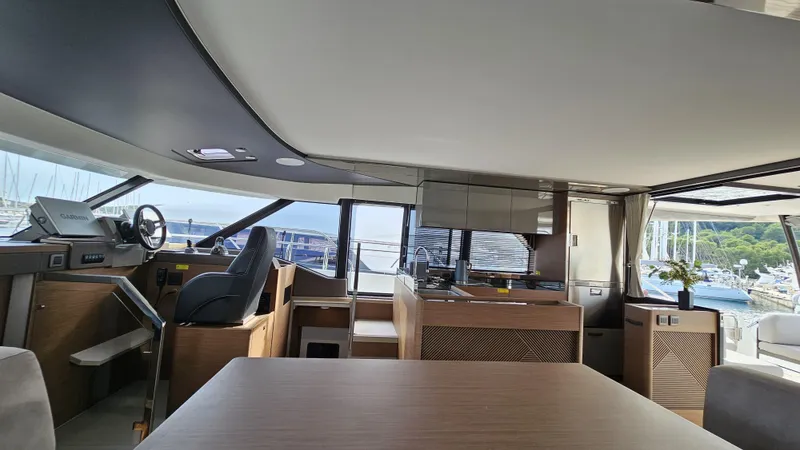 Diamond Si Yacht Photos Pics Luxurious interior of 2024 Prestige M48 yacht with modern design and scenic marina view.