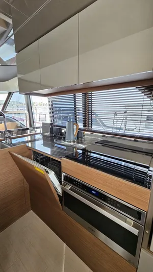 Diamond Si Yacht Photos Pics Modern kitchen in 2024 Prestige M48 yacht with sleek cabinetry and appliances.